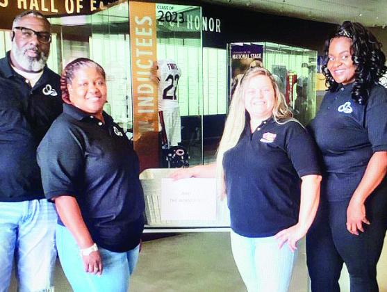 Pictured from left are NLTAC members Jumar Ficklin, Erica Jackson, Cane’s general manager Kathryn Beaudion, NLTAC member and Natchitoches Parish School Board member Tan’Keia Palmer. Not pictured is Super 1 representative Shenita Colbert.