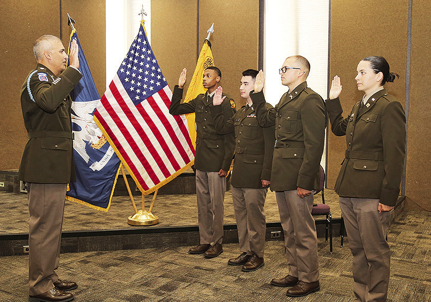 LTC Joshua Drake administered the U.S. Army oath of office to graduating NSU ROTC cadets Christian Holmes, Ethan Jones, Lawson Turner and Layla Wood during a commissioning ceremony for family and friends.