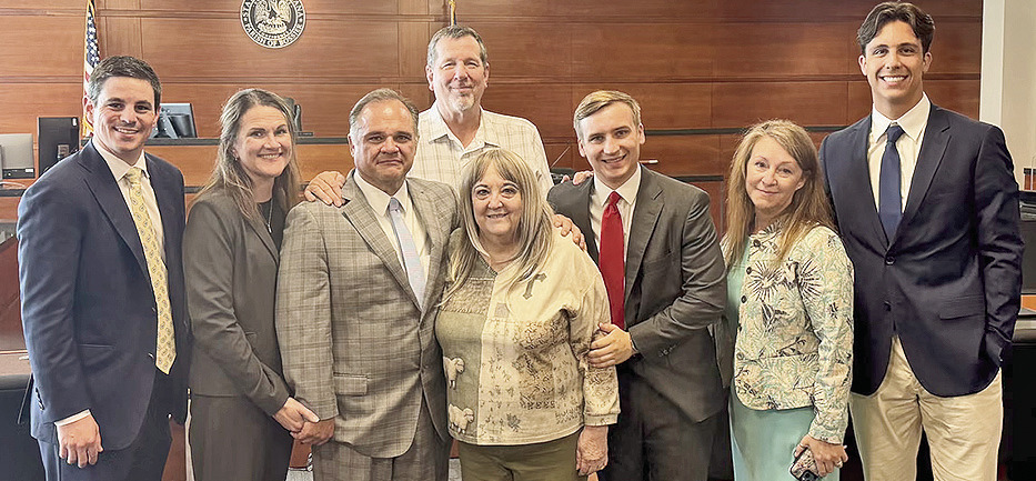 Her legal team joined Pamela Lockridge the day a Bossier Parish jury returned a verdict of more than $1 billion. From left are Stephen Cox, Susan Gatti, Ryan Gatti, Mark Lockridge (back), Pamela Lockridge, Nikolas Roudkovski, Stefanie Phillips and Whitman Johnson.