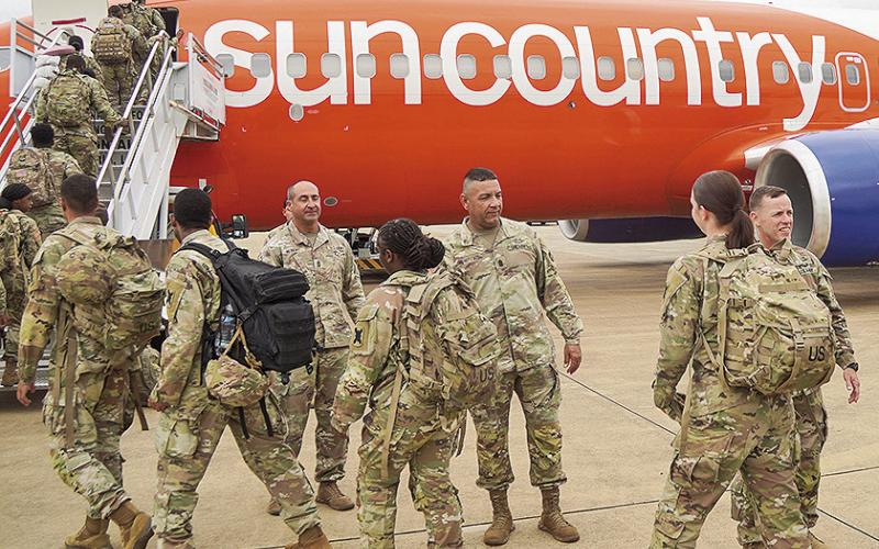 Command Sgt. Maj. Sud A. Robertson, Louisiana National Guard senior enlisted advisor – Army, along with senior LANG leaders, greets deploying Soldiers prior to their departure from Louisiana on May 11. Approximately 125 Louisiana National Guard Soldiers departed for Washington, D.C., where they will support the District of Columbia National Guard, the Metropolitan Police Department, and other law enforcement agencies. (U.S. Army National Guard photo by Sgt. 1st Class Scott D. Longstreet)