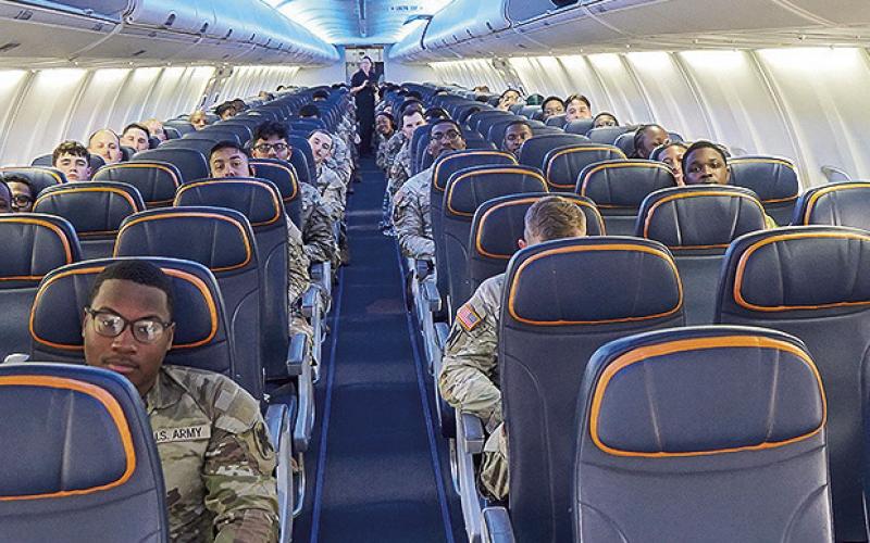Louisiana National Guard Soldiers are on an aircraft departing Louisiana for Washington, D.C., on May 11. Approximately 125 Louisiana National Guard Soldiers deployed in support of a broader National Guard security mission supporting federal and local law enforcement agencies in the District of Columbia. (U.S. Army National Guard photo by Sgt. 1st Class Scott D. Longstreet)