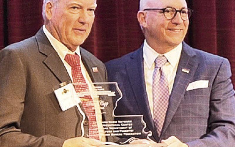 David Cupp, left, president of Walsh Timber Company in Zwolle, was inducted into the Louisiana Agriculture Hall of Distinction Feb. 26 at the L’Auberge Hotel in Baton Rouge. Cupp is pictured with Matt Lee, senior vice chancellor of the LSU AgCenter and dean of the LSU College of Agriculture. Photo by Randy LaBauve/LSU AgCenter