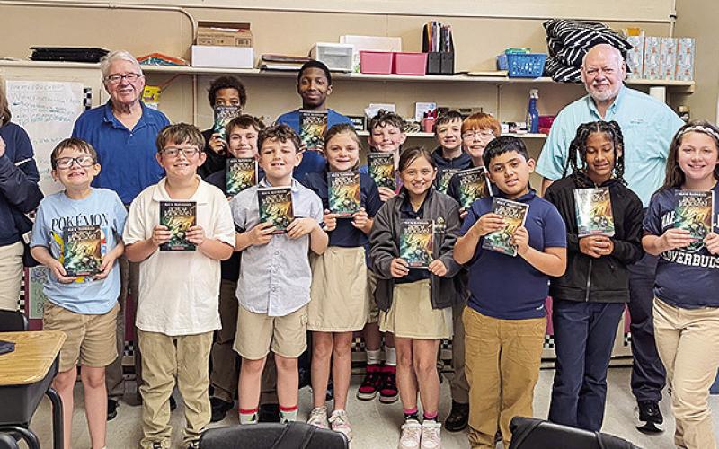 David Zolzer and Frank Fuller delivered books to Marthaville 4th graders.