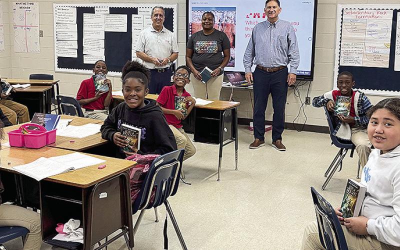 Weaver 4th graders received books from Rotarians Louie Bernard and John Ackel.
