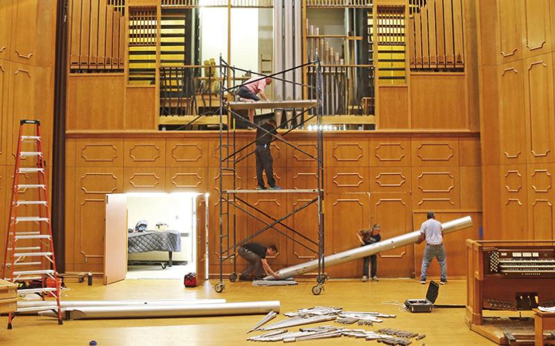 Organ Master and President of Reuter Organ Company JR Neutel, top of scaffold, worked with four assistants to manually remove the largest pipe, which weighs about 300 pounds, from NSU’s famed pipe organ. The instrument’s components are now on their way to Lawrence, Kansas, where they will be cleaned and upgraded, to be reinstalled at NSU later this summer. See story Page 2A. Giving opportunities to support the organ renovation are available at https://northwesternstatealumni.com/organ-restoration/.