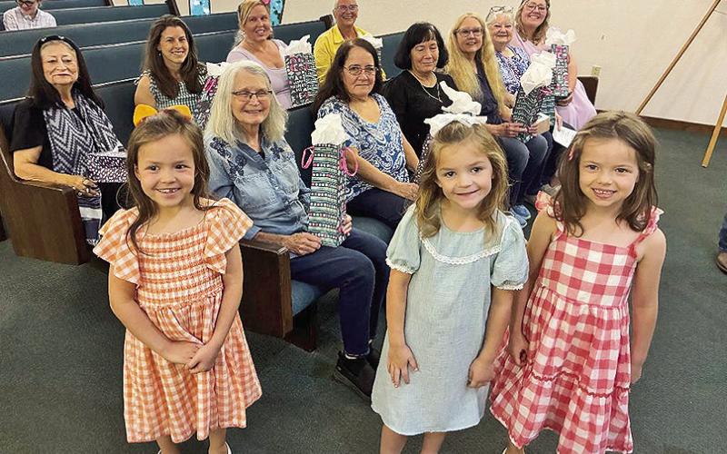 These pretty little misses passed out the Mother's Day gifts at Old Bethel Baptist Church. They are, from left, Rayna Lambert, Maice Smith and Reagan Lambert. Mothers who attended Sunday were, front pew, (front pew), Judy Monett, Jennifer Goleman, Jackie Ford, Linda Byron, Landel Settle and Mackenzie Smith, On second row are Liz Durr, Rhea Lambert, Alicia Raybin and Pam Womack. The picture was part of Liz Durr’s Old Bethel News that can be found on Page 4A.