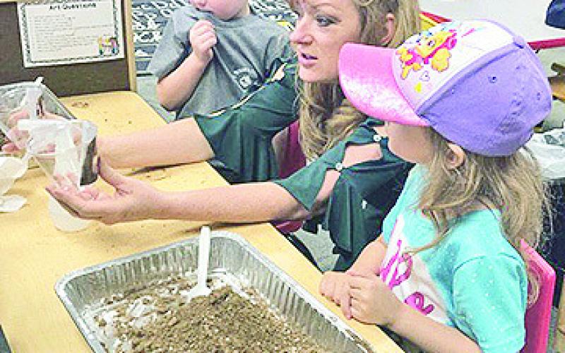 Dr. Debra Jo Hailey worked with children in a Pre-K classroom at Jena Elementary on Dr. Seuss Day.