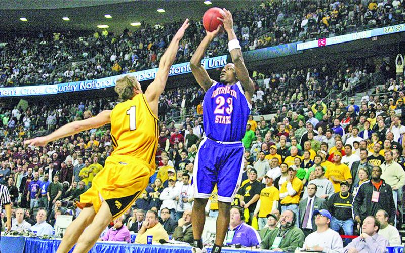 Northwestern State’s Jermaine Wallace releases the game-winning shot over Iowa’s Adam Haluska on March 17, 2006, in the NCAA Tournament. Photo by Doug Daniels