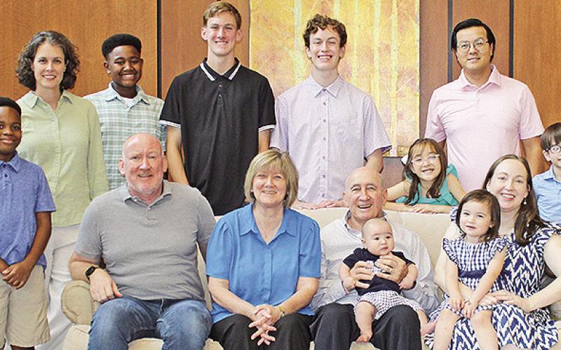 The Strange family are, seated from left, Micah Strange, Susan and Dan Strange, Grant Nguyen, Camille Nguyen and Jessica Strange Nguyen. Standing are Joshua, Jennifer, Calvin, Isaac and Noel Strange and Madeleine, Thang (T) and Everett Nguyen.