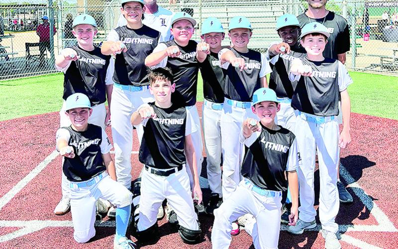 Team LA Lightning 12U of Natchitoches won the USSSA MLB Opening Day Classic in Bossier. The team won unique #22 Juan Soto rings as a part of the tournament. On front row from left are Archer Johnson, Gavin Key and Carter Hough. On middle row are Jax Errington, Murphy Linebaugh, Liam Mahloch, Hendrix Johnson, Adam Todtenbier, RJ Braden and Luke Fair. On back row are Coaches Luke Mahloch and Evan Gandy