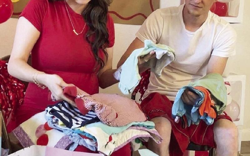 Amanda Weeks and Wheeler Ham admiring baby shower gifts Saturday.