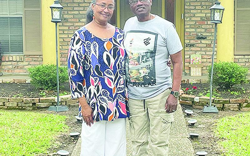 Wilbert Jones, who spent 46 years incarcerated after having been wrongfully convicted, and his wife Mary stand in front of the Baton Rouge home they were able to buy with money from the state’s Innocence Compensation Fund. Cross Harris/LSU Manship School News Service