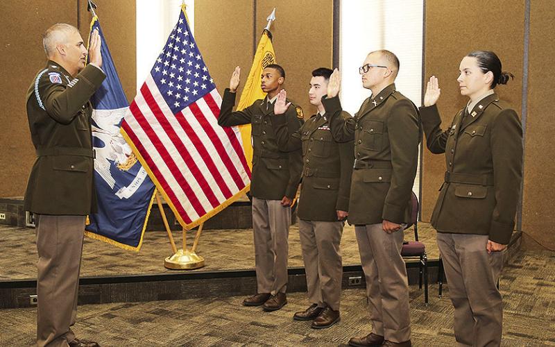 LTC Joshua Drake administered the U.S. Army oath of office to graduating NSU ROTC cadets Christian Holmes, Ethan Jones, Lawson Turner and Layla Wood during a commissioning ceremony for family and friends.