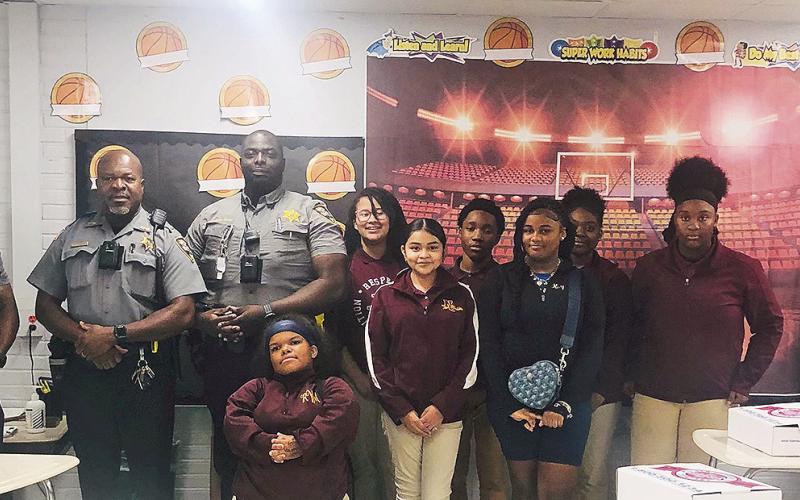From left are Officer Duruisseau, Lt. Turner, Officer Owusu-Duku, Ronnie Wilson, Fergie Torrecillas, Cadynce Smith, Joshua Jackson, Kayleigh Fox, Kennedy Bradley, Chelsea Robinson and Joshua Lockhart.