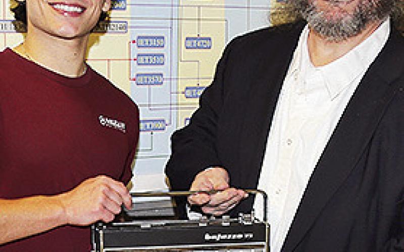 Engineering Technology student Hayden Alberes, at left, of Pierre Part repaired a 1960s Telefunken shortwave radio that belonged to the father of NSU Professor of History Dr. Charles Pellegrin.