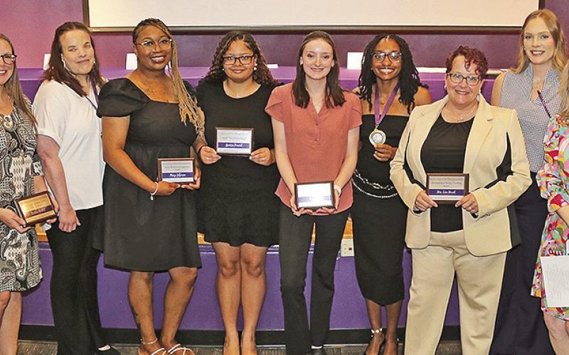 Honorees from the Department of Social Work were, from left, Dr. MaryAnne Candley, Dustina Guillot, Amanda Spraggins, Aleeya Jefferson, Marissa Howard, Kaci Green, Kiley Gatson, Lisa Mount, Greere Koehler, Dr. Susan Campbell and Randy Hoffpauir.
