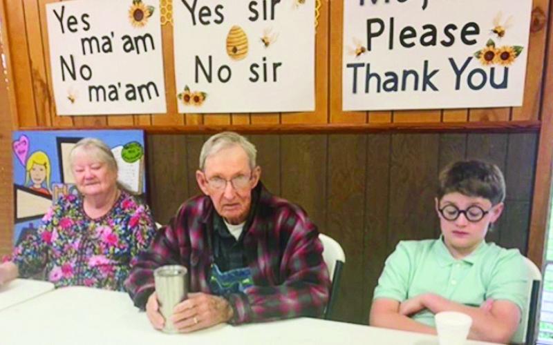 Lanell and John Settle and their great-grandson enjoy drinks at Old Bethel breakfast Easter Sunday.