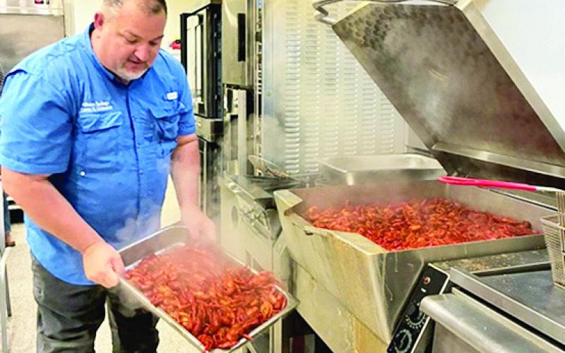 Bubba Jack Mills cooking crawfish for the Camper on Mission at Clara Springs last Thursday.