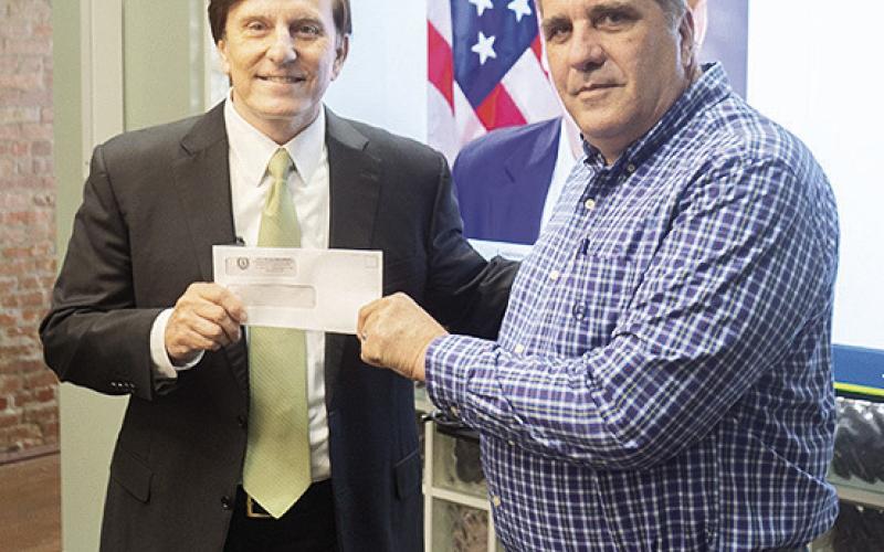 Treasurer Fleming delivered an unclaimed property check for $11,975 to Lafayette resident Kenneth Duhon, the rightful owner.