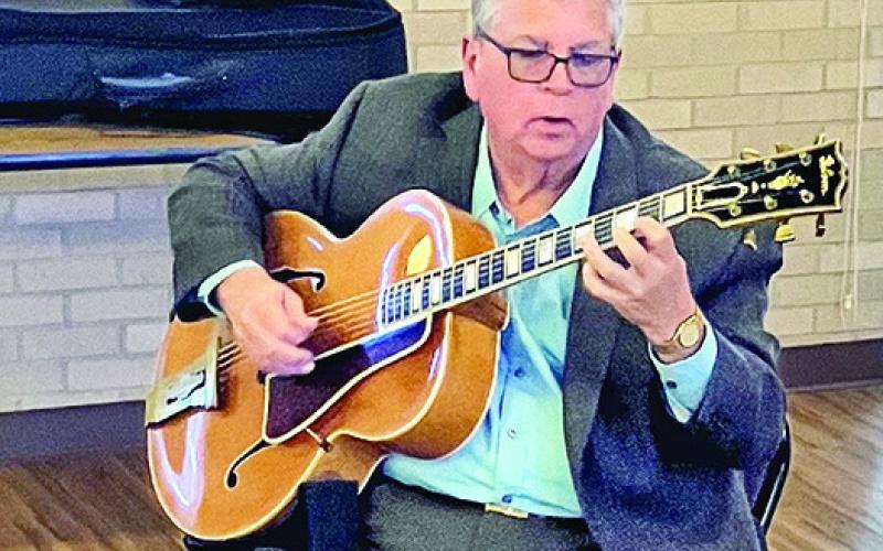 Luke Brouillette charmed the group with his pick style playing of several beautiful pieces by memory.