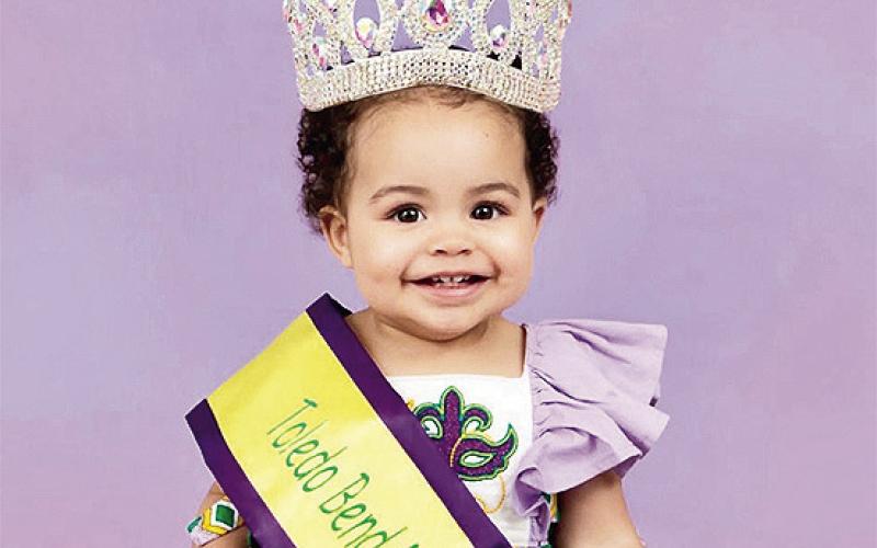 Hallie Jane Kijanski, 3, won Over - All Grand Supreme Queen and Over-All Most Beautiful in the Toledo Mardi Gras Pageant on Feb 7.