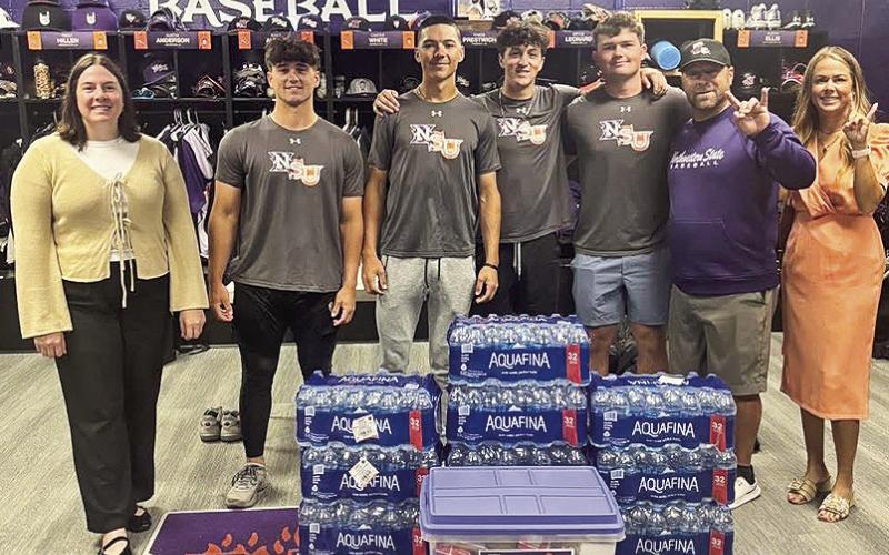Fork ’Em Demons. BOM Bank is the official bank of NSU Athletics and to support our Demons on and off the field BOM donated cases of water and a snack tub to fuel the team for their trip to UTRGV. From left BOM’s Claire Mayeaux, Brody Belanger, Sam Ardoin, Brooks Leonard, Colton Harrison, Head Coach Chris Bertrand and BOM’s Carrie Hough.
