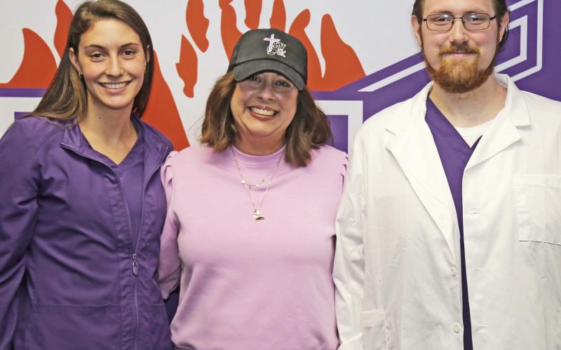 Alexander Guillory, right, was named the 2026 recipient of the Lauren Vaughn Memorial Scholarship, presented to a students enrolled in NSU’s accelerated BSN program at the Alexandria-Cenla campus. Bridget Vaughn, center, presented the award and recognized last year’s recipient, Jesci Lord, left, who will graduate in August.