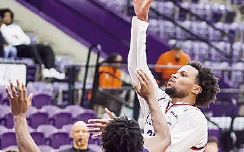 Willie Williams hits the go-ahead layup with four seconds left to end their seven-game losing streak at Beaumont, defeating Lamar 70-68. Photo by Chris Reich, NSU Photographic Services