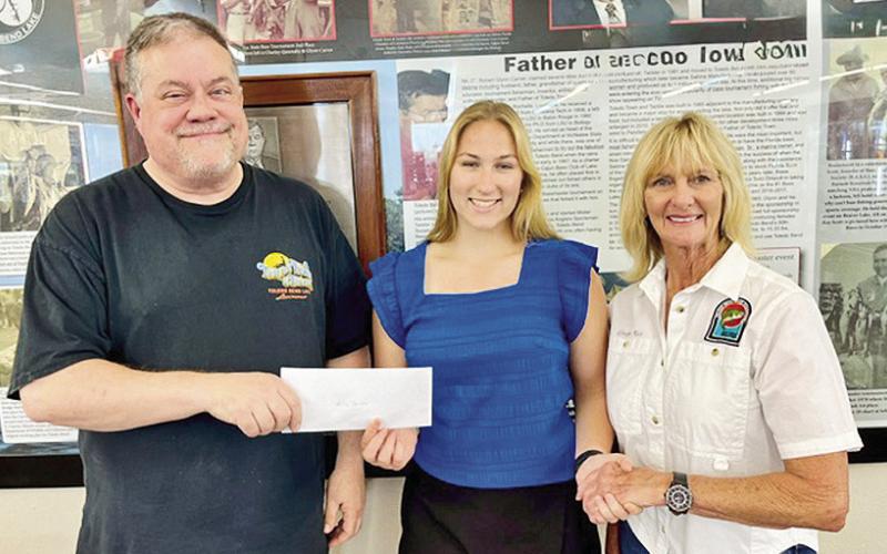 The Toledo Bend Lake Association awards the Glynn Carver Memorial Scholarship for $5,000 to Allie Tarver of Florien High School. From left are Curt Carver, scholarship recipient Allie Tarver, and TBLA President Ginger Rice.