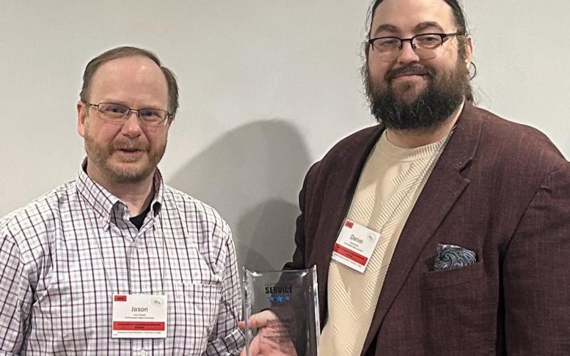 Dr. Daniel Gordy was recognized for outstanding service. At left is Assistant .Professor Jason Powell.