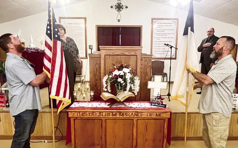 Charley Hawkes posted the American flag and Sean Wester posted the Christian Flag for Memorial Day at Bellwood Baptist Church while Tammy Wyatt led the pledges and Bro. Roger assisted.