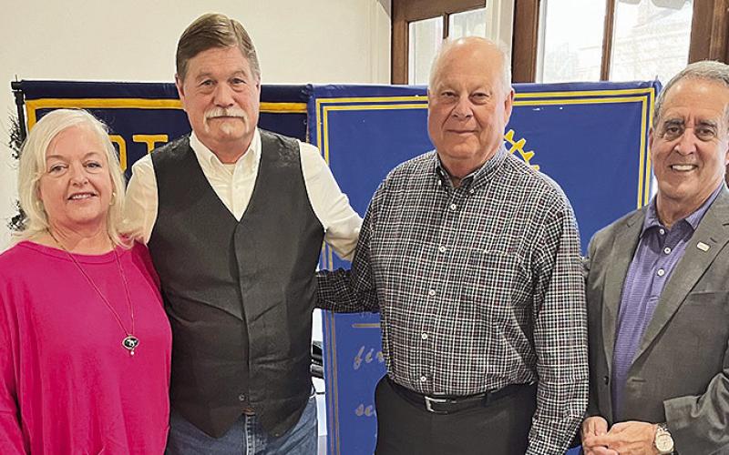 Rotarian with the Program Tommy Caldwell welcomed photojournalist Stan Alost who discussed his career and the future direction of photojournalism. From left are his wife Paige, Stan Alost, Caldwell and Rotary President Louie Bernard.