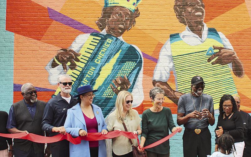 Ribbon cutting for a new mural titled, ‘At Sunset,’ at The Funky Flea in the Sunset Cultural District in Sunset,by artists Liz and Jed Cornett. (Image credit: Louisiana Office of Cultural Development)