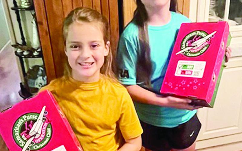 Grayson Masters, Ruby Carson and Jackson Hawkes led the congregation at Bellwood Baptist Church in singing and motioning the song, “Those on the Lord’s side say Amen!”