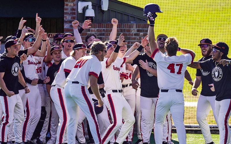 Northwestern State’s team celebrates Colton Harrison’s go-ahead, tworun home run Sunday. Photo by Chris Reich/NSU Photographic Services.