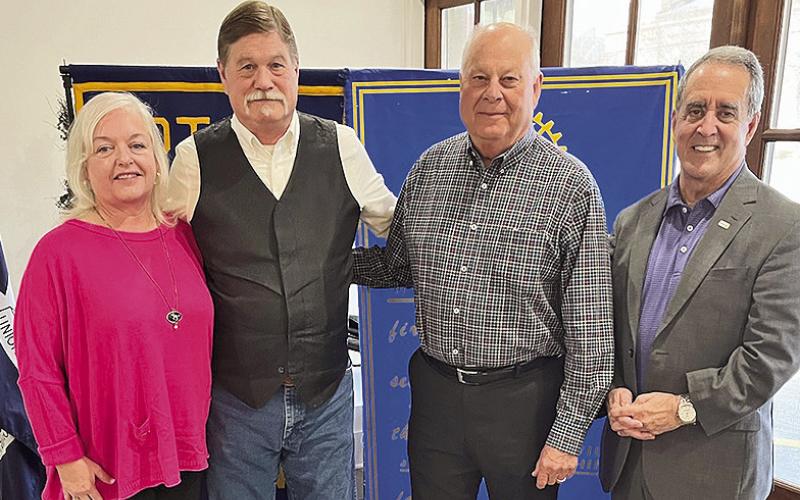 Rotarian with the Program Tommy Caldwell welcomed photojournalist Stan Alost who discussed his career and the future direction of photojournalism. From left are his wife Paige, Alost, Caldwell and Rotary President Louie Bernard.