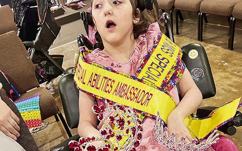 Elizabeth Smith, 9, who has Holoprosencephally and Cerebral Palsy, participated in a special abilities pageant and won queen in her division and Ambassador.