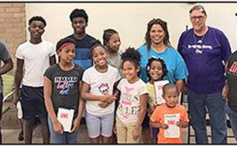 Evangelist Bonita Moses Arnold is pictured with local FCA in Natchitoches Parish Library on 450 second street, as a sponsor.