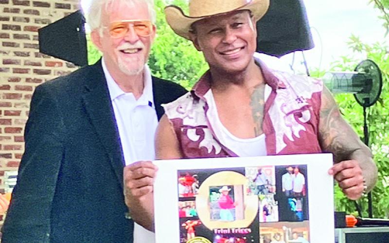 Natchitoches’ own Trini Triggs is inducted into the Louisiana Music Hall of Fame. Pictured from left are Mike Shepherd of LMHF and Triggs.