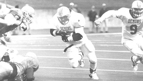 Rob Robertson, center,) scores a touchdown during his Northwestern State playing career. Photo by Northwestern State Athletics