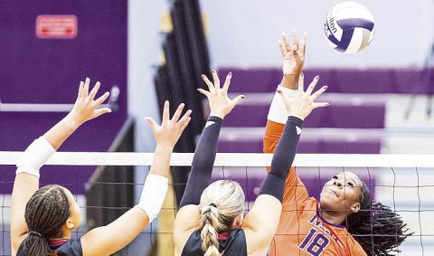 Deja Benjamin attempts a kill. Photo by Chris Salim