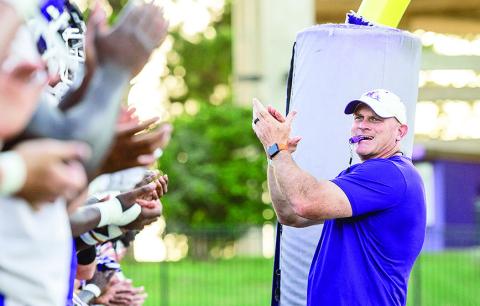 Head coach Blaine McCorkle (right) gets his team ready for its first workout of the 2025 fall camp. Photo by Chris Reich/NSU Photographic Services