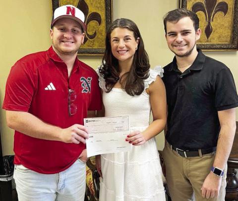 BOM sponsored the Natchitoches 12U All Stars baseball team who recently competed in the State tournament. Pictured from the left Coach Luke Conway, BOM’s Mary Scruggs and Zach Cooper.