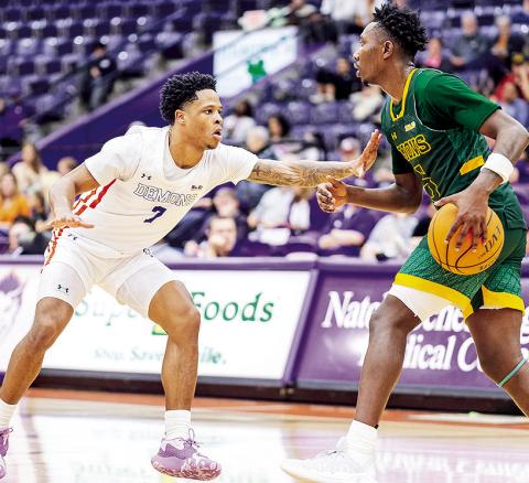 Love Bettis (left) guards Southeastern’s Jakevion Buckley during Saturday’s game in Natchitoches. Photo by Chris Reich/NSU Photographic Services