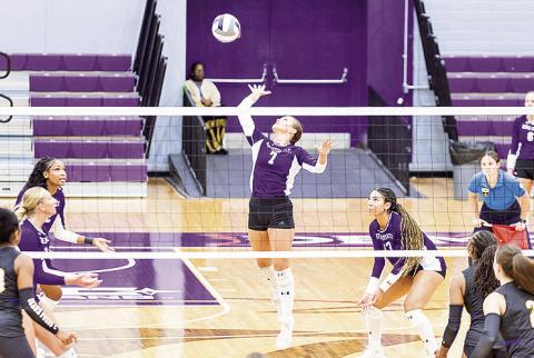 Harper Cauley attempts a kill in Wednesday match against McNeese at Prather Coliseum. Photo by Chris Reich, NSU Photographic Services