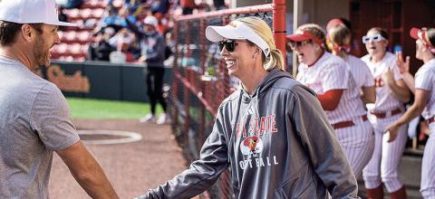 Jenny Fuller (center) when she coached at PSU. Photo courtesy of Pittsburg State Athletics