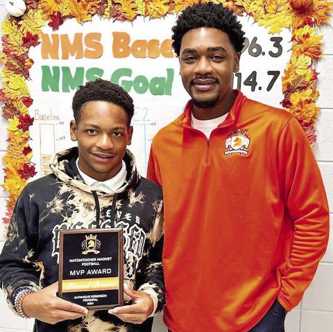 Blessed Brown of Natchitoces Maganet proves that you can excel both on the field and in the classroom. This incredible student-athlete was awarded MVP for his outstanding performance on the football field this season. Brown led the team in scoring, with a 5touchdown game that had everyone cheering. Pictured from the left are Brown and principal Antavious Roberson.
