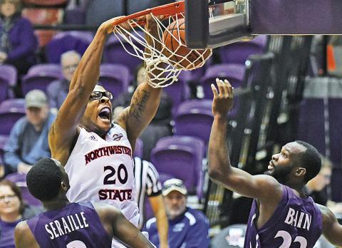 Ishmael Lane (center) dunks during a game against Stephen F. Austin in the 2017-18 season. Credit: Gary Hardamon/NSU Photographic Services
