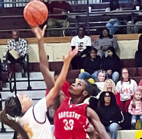 Lady Chief Anna Newton (at left), tips-off against Haughton.