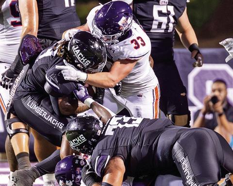 Landry Huddleston (33) recorded a career-high 12 tackles at Nicholls. Photo by Chris Reich/NSU Photographic Services